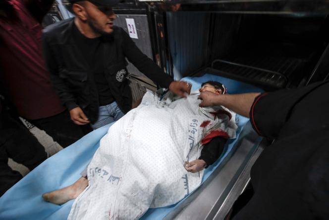 The body of a 13-year-old boy in the morgue of Al-Shifa hospital after he was killed by an Israeli air strike on May 9, 2023.