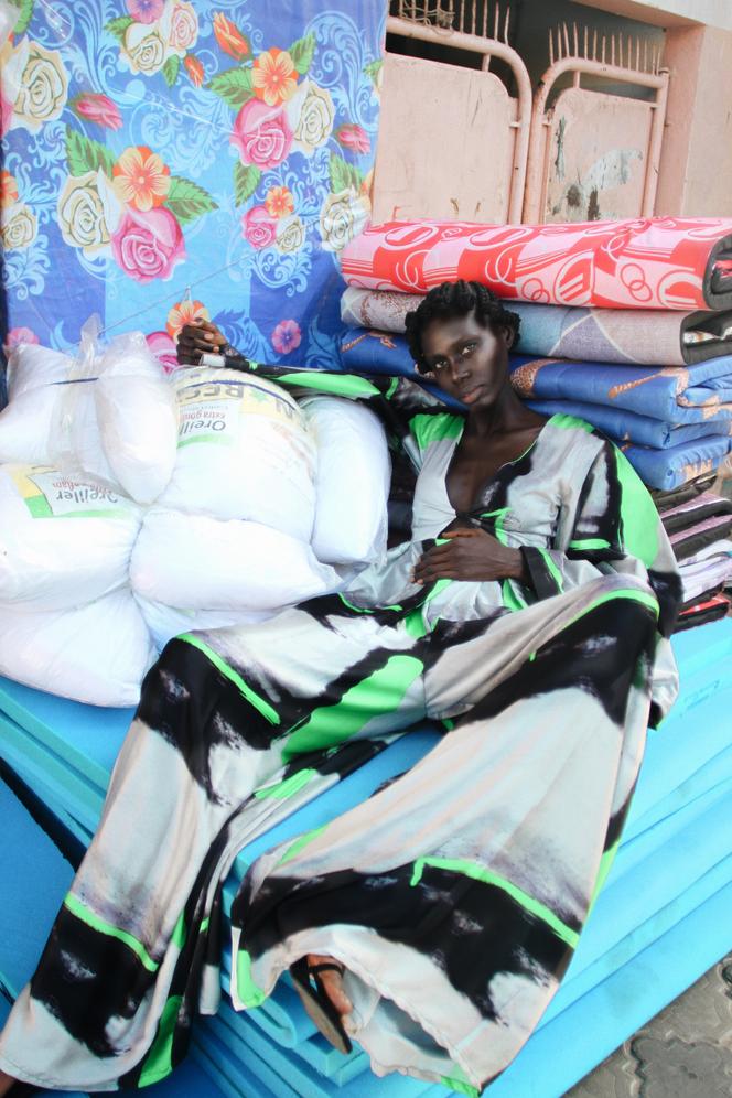 A model posing with an outfit signed Tongoro, in the Medina district, in Dakar, in January 2022.