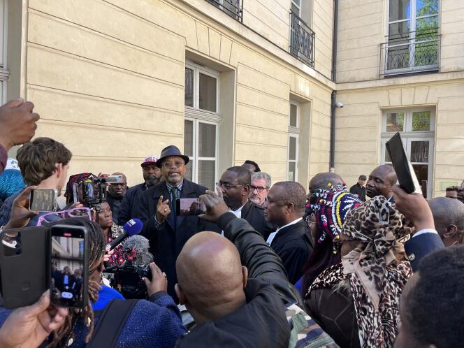 Rouen philosophy professor Franklin Nyamsi (with hat), accompanied by his lawyers, in the courtyard of the Rouen administrative court, May 3, 2023.