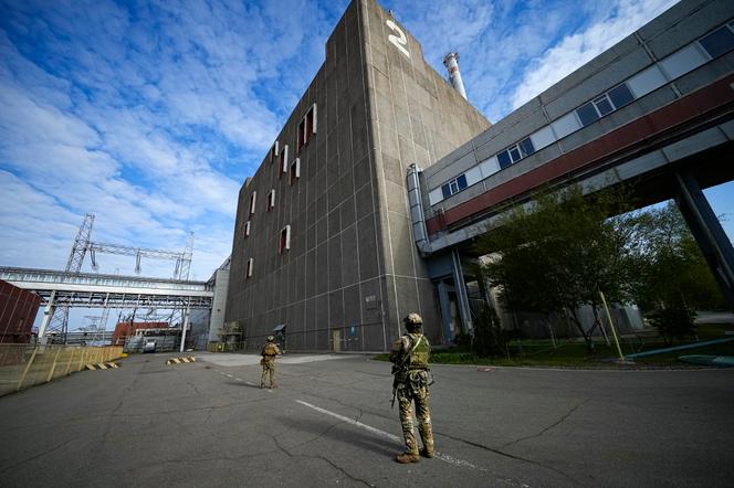 Russian servicemen guard an area of the Zaporizhzhia Nuclear Power Station, in territory under Russian military control, southeastern Ukraine, on May 1, 2022. R