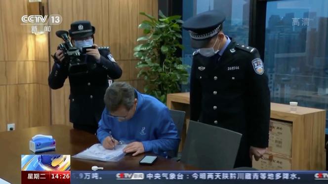 In this image taken from an undated CCTV video, Chinese police carry out law enforcement operations during a raid on Capvision's offices in Shanghai. 