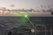 Green military-grade laser light from a Chinese coast guard ship in the disputed South China Sea, on Feb. 6, 2023. 