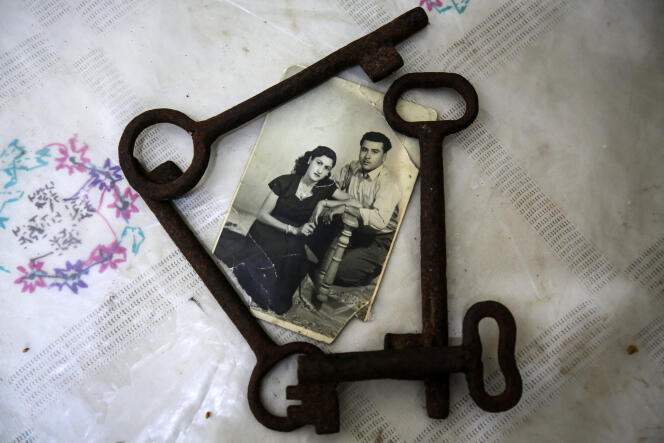Keys belonging to Ebthaj Dawl, a Palestinian Nakba refugee, and a wedding photo picturing her at her home in Gaza.  May 7, 2023.