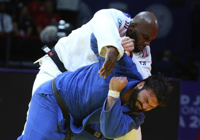 Teddy Riner and Inal Tasoev, during their fight in the +100kg final at the World Judo Championships in Doha on May 13.