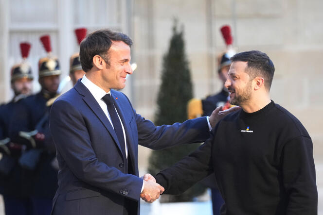 French President Emmanuel Macron, right, welcomes Ukrainian President Volodymyr Zelenskyy at the Elysee palace in Paris, Sunday, May 14, 2023.
