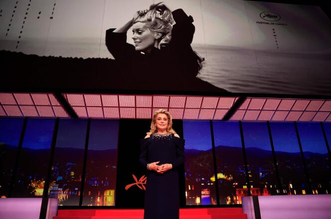 French actress Catherine Deneuve stands on stage during the opening ceremony of the 76th edition of the Cannes Film Festival in Cannes, southern France, on May 16, 2023. 