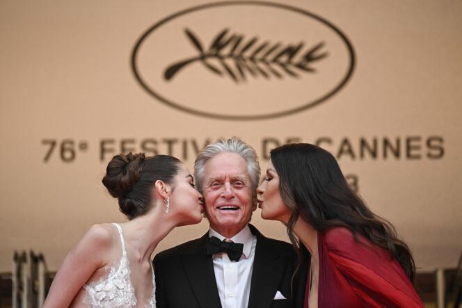 Michael Douglas (C) arrives with his wife Catherine Zeta-Jones (R) and daughter Carys for the opening ceremony of the 76th edition of the Cannes Film Festival in Cannes, southern France, on May 16, 2023.  