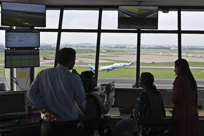 Air traffic controllers monitor as an aircraft takes-off from the Anna International Airport on the occasion of the International Day of the Air Traffic Controller, in Chennai on October 20, 2022. 