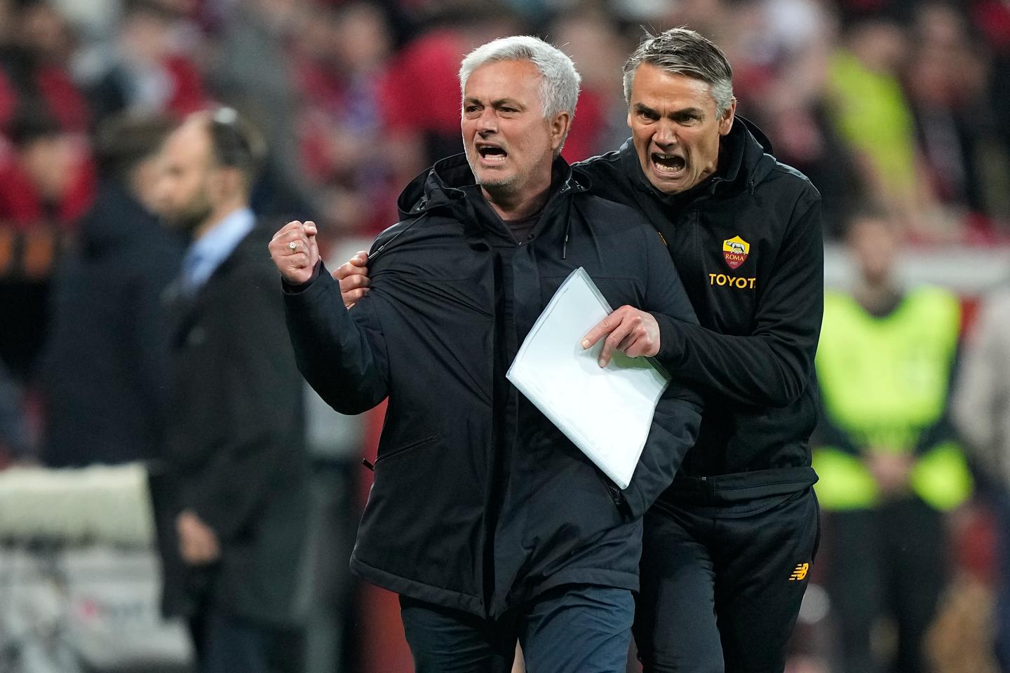 Mourinho's Roma faces Sevilla in Europa League final showdown 2 Roma coach Jose Mourinho, left, celebrates after the Europa League semifinal second leg soccer match between Bayer Leverkusen and Roma at the BayArena in Leverkusen, Germany, Thursday, May 18, 2023.