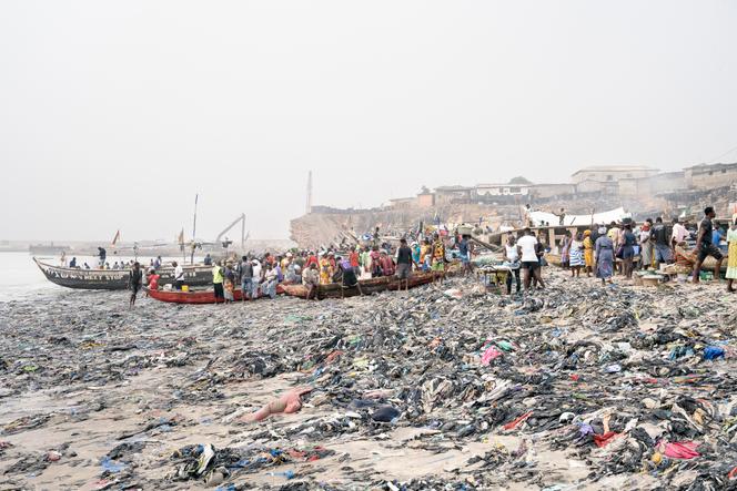 On February 19, 2023, in the fishing port of Accra, the capital of Ghana.  The beach is full of second-hand clothes from industrialized countries that arrive in Accra every week.