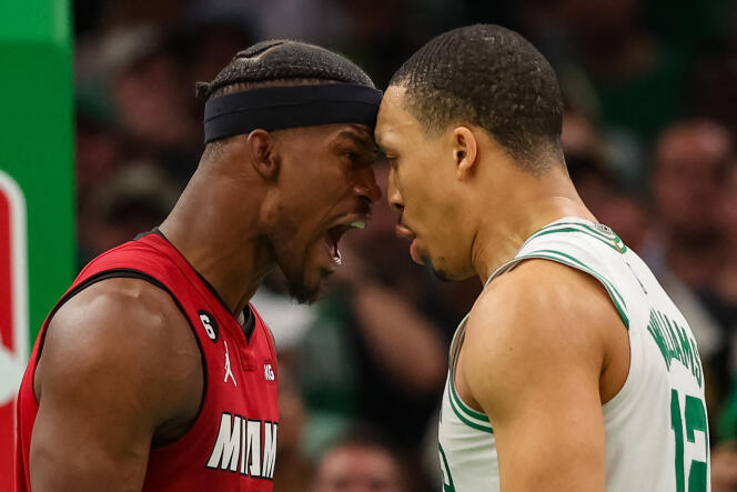 Miami Heat player Jimmy Butler (red jersey) forehead to forehead with Celtics player Grant Williams on May 19, 2023 in Boston.