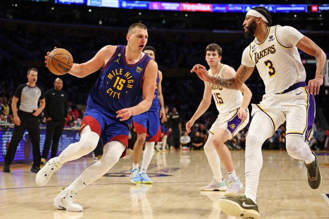 Nikola Jokic #15 of the Denver Nuggets drives in the basket against Anthony Davis #3 of the Los Angeles Lakers during the fourth quarter in game three of the Western Conference Finals at Crypto.com Arena on May 20, 2023 in Los Angeles, California.