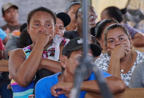 Relatives of the victims of the Mahdia fire during Guyana's President Irfan Ali's press conference on May 22, 2023.