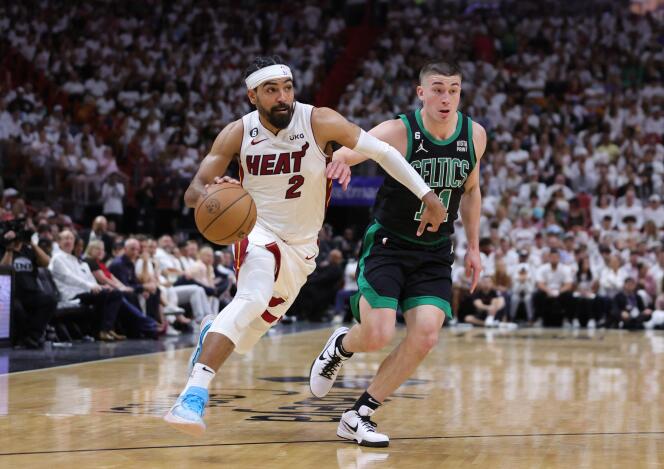 Gabe Vincent of the Miami Heat drives against Payton Pritchard of the Boston Celtics in game three of the Eastern Conference Finals at Kaseya Center on May 21, 2023 in Miami, Florida. 