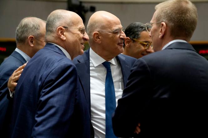 Greek foreign minister Nikos Dendias (center), Polish foreign minister Zbigniew Rau (left) and Latvian foreign minister Edgars Rinkevics at the European Council in Brussels, on May 22, 2023.