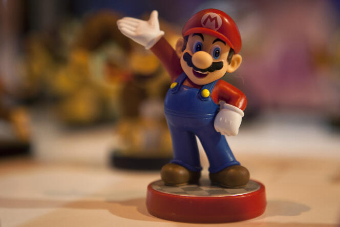 A figurine representing the video game character Mario, in 2015.