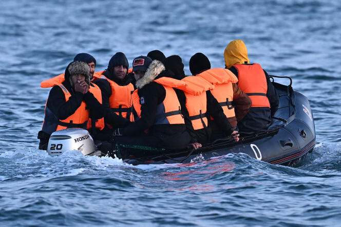 Migrants on an inflatable boat across the English Channel, bound for Dover on the south coast of England. 