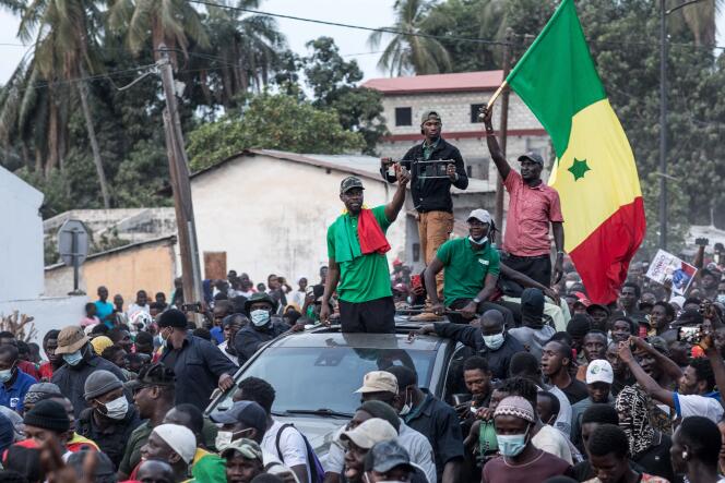 Opposition leader, Ousmane Sonko, waves to his supporters during a meeting in Ziguinchor on May 24, 2023.