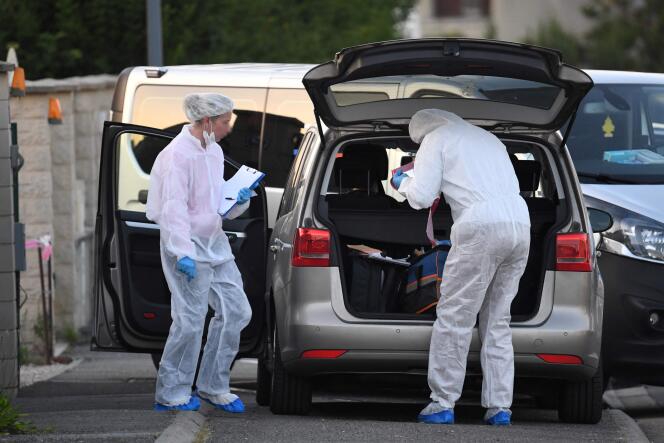 Forensic officers outside the house where the bodies of a woman and two children were found in Dreux, northwestern France, on May 25, 2023.