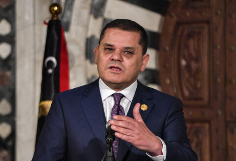 Libya's Tripoli-based Prime Minister Abdulhamid Dbeibah gives a joint press conference with his Tunisian counterpart in Tunisia's capital Tunis on November 30, 2022, during his two-day working visit. (Photo by FETHI BELAID / AFP)