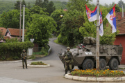 Austrian soldiers serving in peacekeeping mission in Kosovo, KFOR, guard a street in the town of Zvecan, northern Kosovo, Thursday, June 1, 2023. 