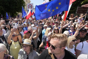 Participants join an anti-government march led by the centrist opposition party leader Donald Tusk in Warsaw on Sunday, June 4, 2023.