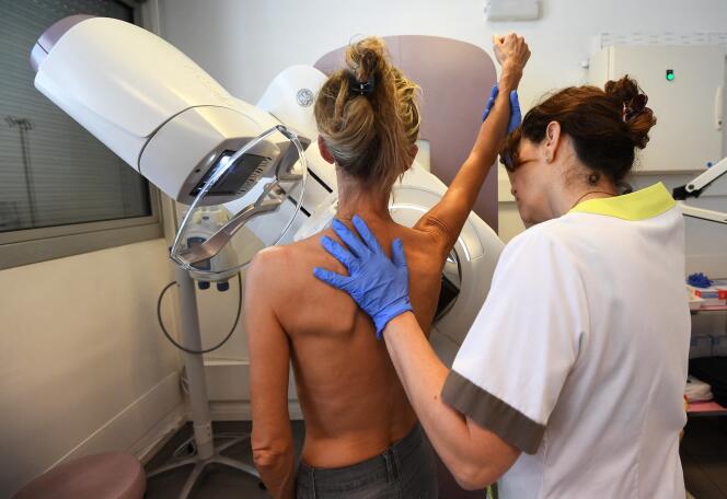 A patient prepares for a mammogram at the Paoli-Calmette Institute in Marseille on October 9, 2017. 