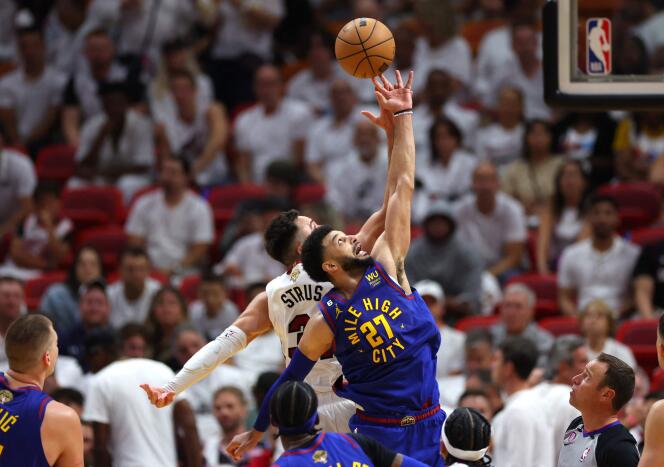 Denver Nuggets player Jamal Murray (blue jersey) against the Heat in Miami on June 7, 2023.