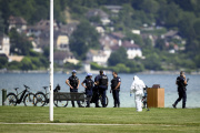 Police are investigating the scene of a knife attack on Lake Annecy on June 8, 2023.