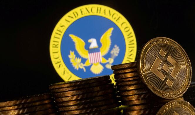 Le logo de la Securities and Exchange Commission des États-Unis et les représentations de la crypto-monnaie Binance le 6 juin 2023. 