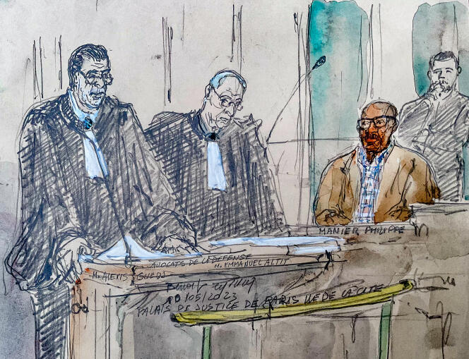 Former Rwandan gendarme Philippe Hategekimana and his lawyers during his trial at the Paris courthouse.