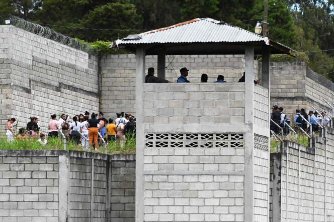 Prison guards watch inmates of the Women's Center for Social Adaptation (CEFAS) prison following a brawl between inmates in Tamara, Honduras, on June 20, 2023.