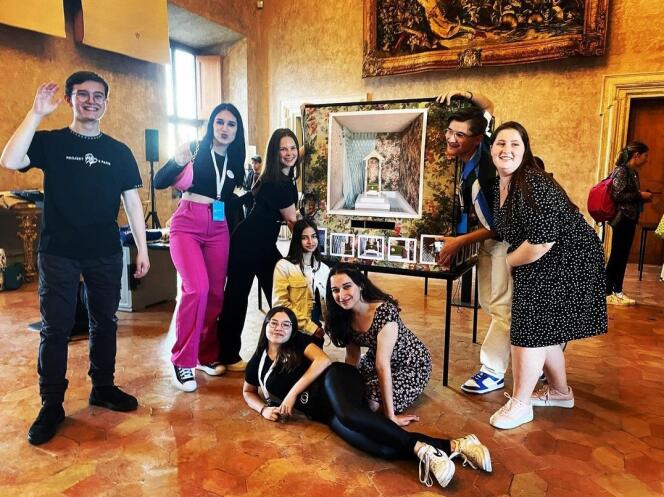 Eight of the students of the Ozanam high school in Châlons-en-Champagne pose in front of their work, at the Villa Medici, in Rome, on May 7, 2023.