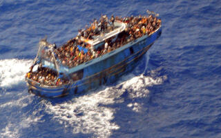 FILE PHOTO: An undated handout photo provided by the Hellenic Coast Guard shows migrants onboard a boat during a rescue operation, before their boat capsized on the open sea, off Greece, June 14, 2023. Hellenic Coast Guard/Handout via REUTERS ATTENTION EDITORS - THIS IMAGE HAS BEEN SUPPLIED BY A THIRD PARTY./File Photo