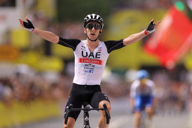 Adam Yates celebrates as he beats his twin brother Simon to the finish line in Bilbao, Spain, on July 1, 2023.
