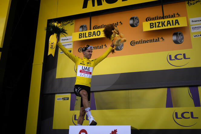 Adam Yates wearing the overall leader's yellow jersey in Bilbao, Spain, Saturday, July 1, 2023.