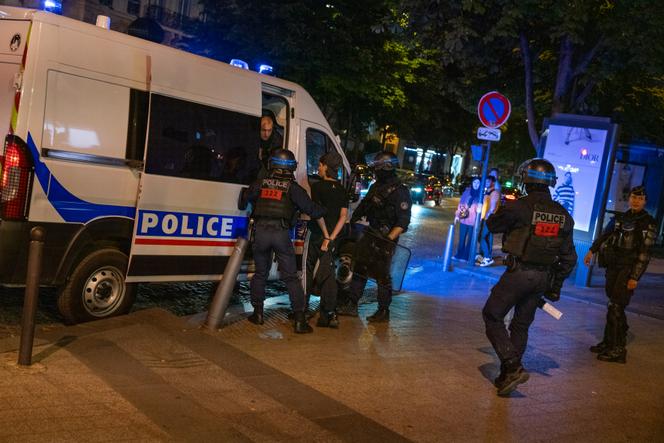 A young man arrested by police on the Avenue des Champs-Elysées, Paris, on the night of July 1, 2023.