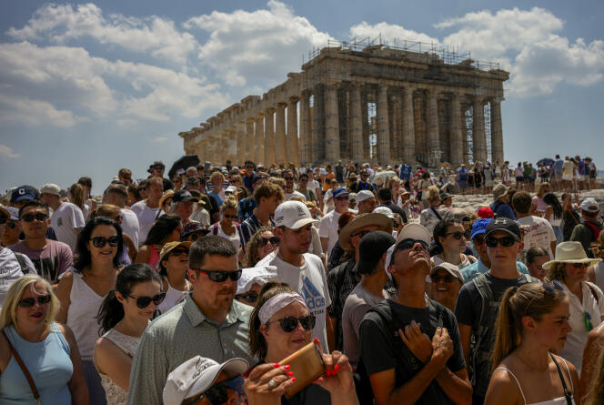 A crowd of tourists visit the Acropolis in Athens on July 4, 2023.
