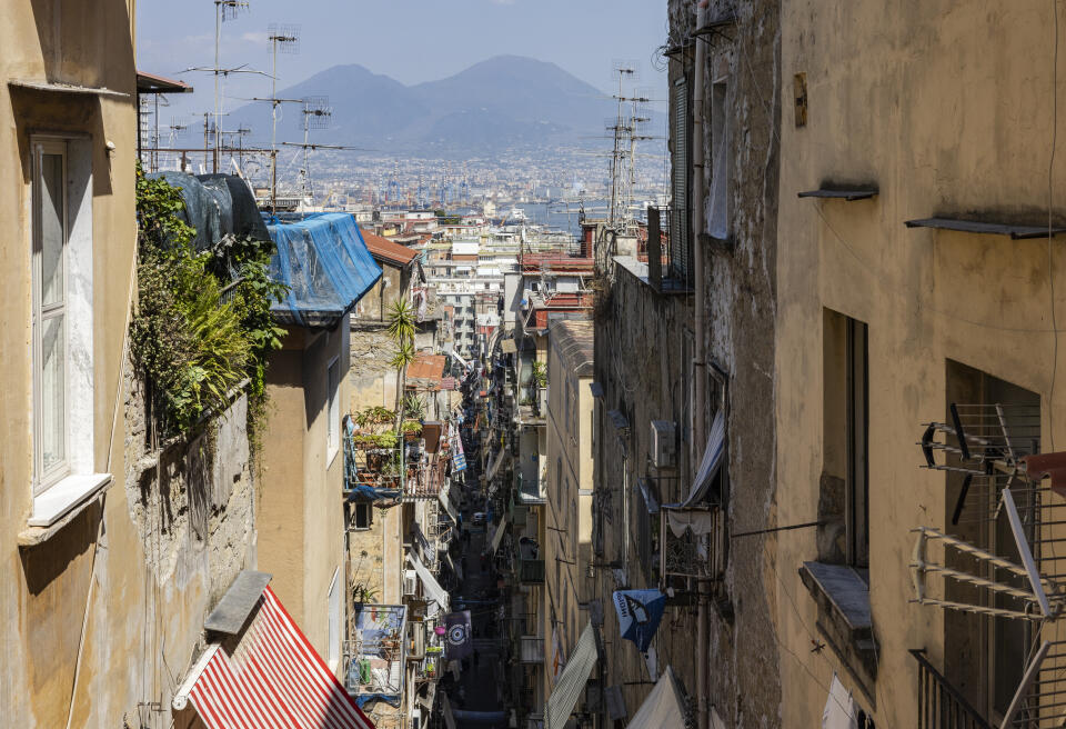 07 July 2023, Naples, Italy - A top view of the Spanish Quarters with the volcano Vesuvius.