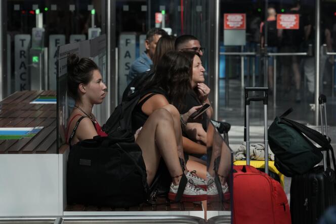 Passengers wait for their flights during a nationwide strike of airport staff, and check-in services at Rome's Fiumicino International airport, Saturday, July 15, 2023.