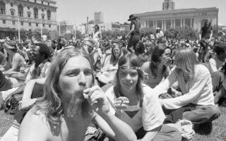 SAN FRANCISCO, CA - MAY 28: Marijuana is smoked while "Day on the Grass" "smoke-in" participants bask in the sunshine in Civic Center Plaza in San Francisco, Calif. on May 28, 1978. The 2021 "4/20 Day" smoke-in was cancelled because of COVID-19 safety protocols. (Terry Schmitt/The San Francisco Chronicle via Getty Images)