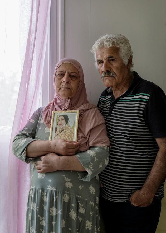Djohar and Kamel Daoud with a photo of their daughter Chahinez 