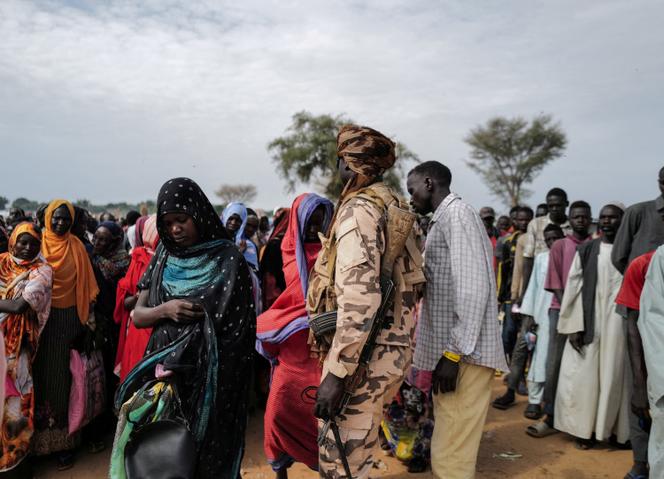 Sudanese refugees line up at a World Food Program ration distribution in Adré, Chad, on July 20, 2023.