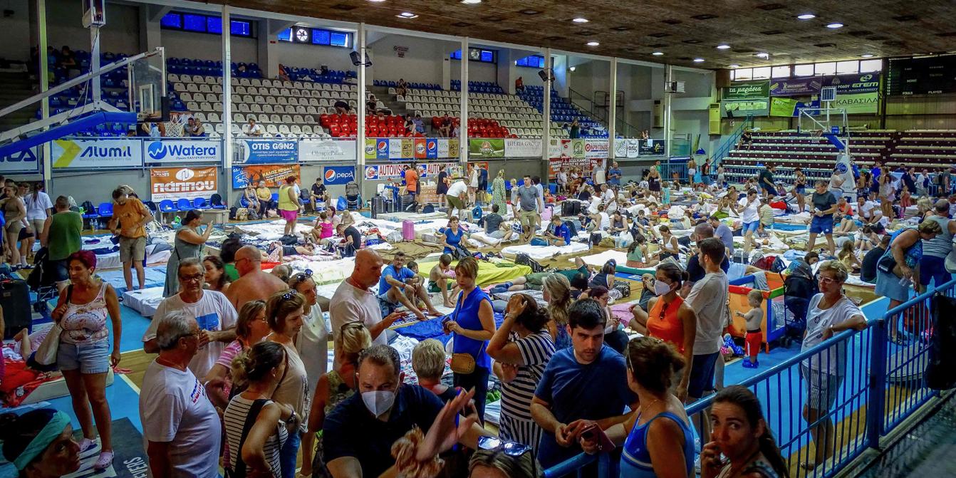 Thousands of tourists evacuated during blazing wildfires on Greek