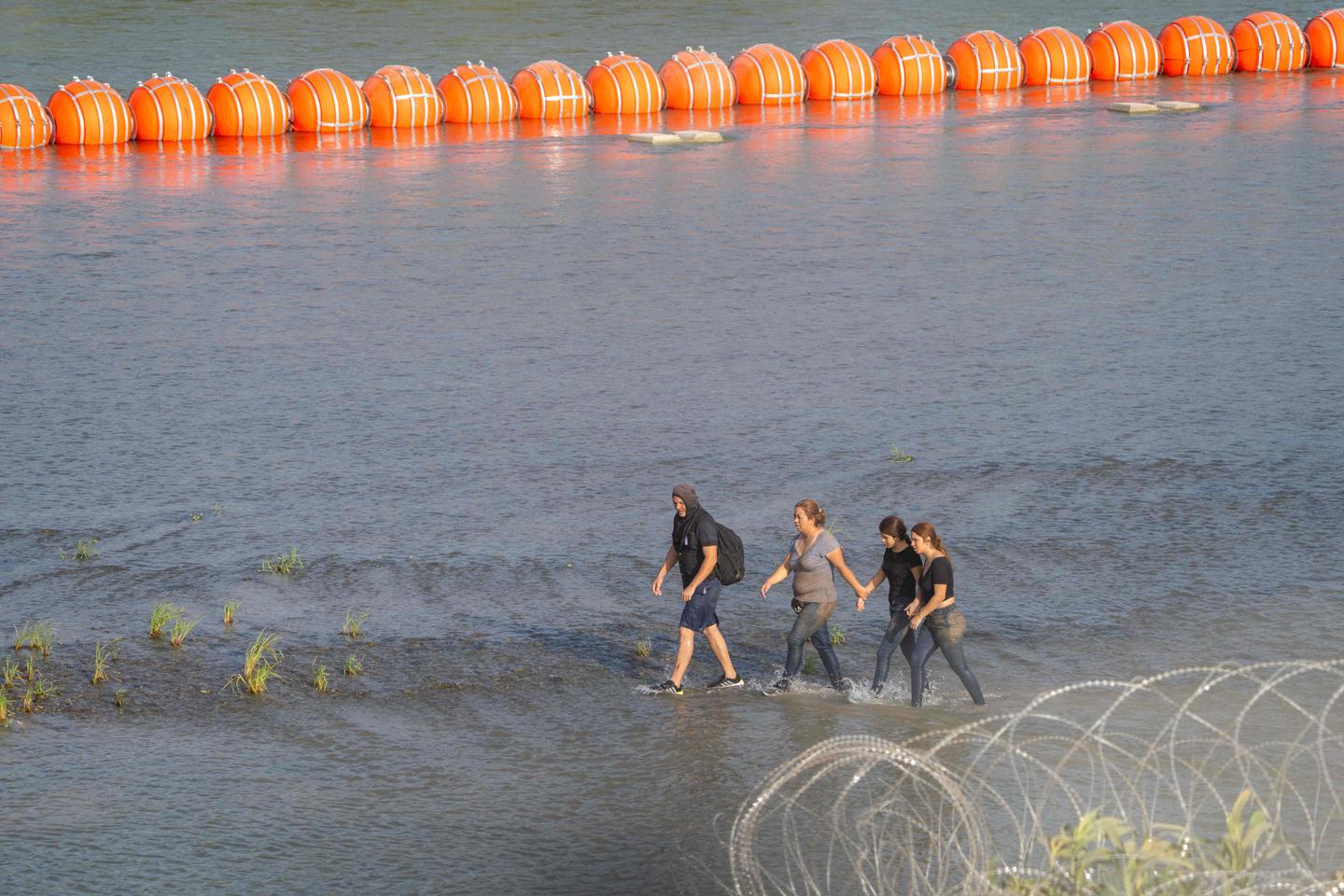 Biden administration sues Texas governor over Rio Grande barrier meant ...