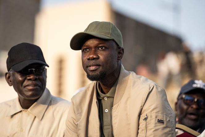 Opposition leader Ousmane Sonko looks on during an opposition meeting two days before his trial, in Dakar on March 14, 2023.