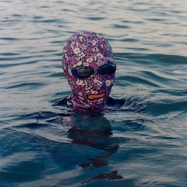 Alex Huanfa Cheng A woman swimming with a sun mask In Qinghuangdao 2018