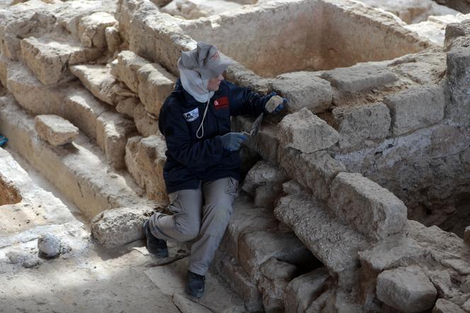 A Palestinian student works on the archaeological site of Saint Hilarion, in the central Gaza Strip, on March 7, 2023.