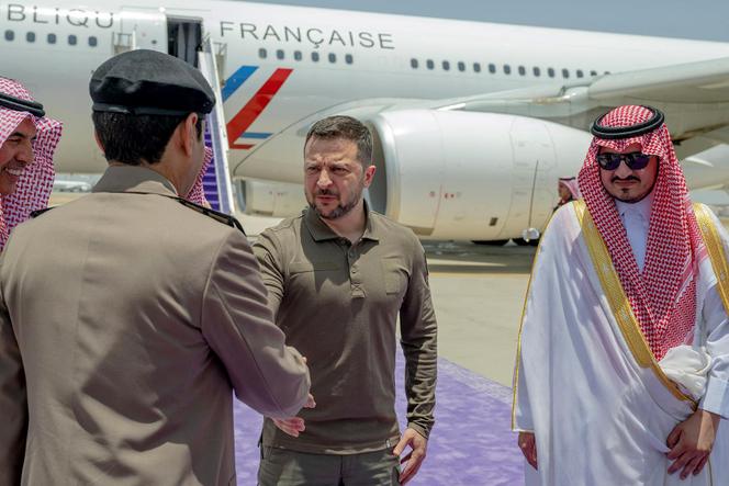 This handout picture provided by the official Saudi Press Agency SPA, shows Ukraine's President Volodymyr Zelensky greeting Saudi officials next to the Deputy Emir of Mecca, Prince Badr bin Sultan bin Abdulaziz (R), in Jeddah where the former arrived on May 19, 2023 to participate in the Arab League Summit.