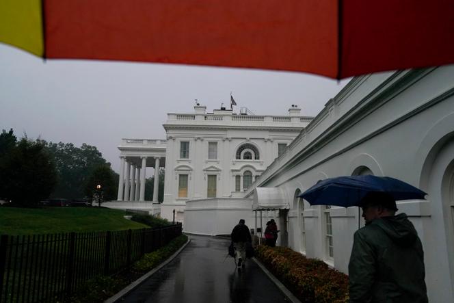 Members of the media walk to the press briefing room of the White House, on August 7, 2023. Thousands of federal employees were sent home early Monday, in Washington DC.